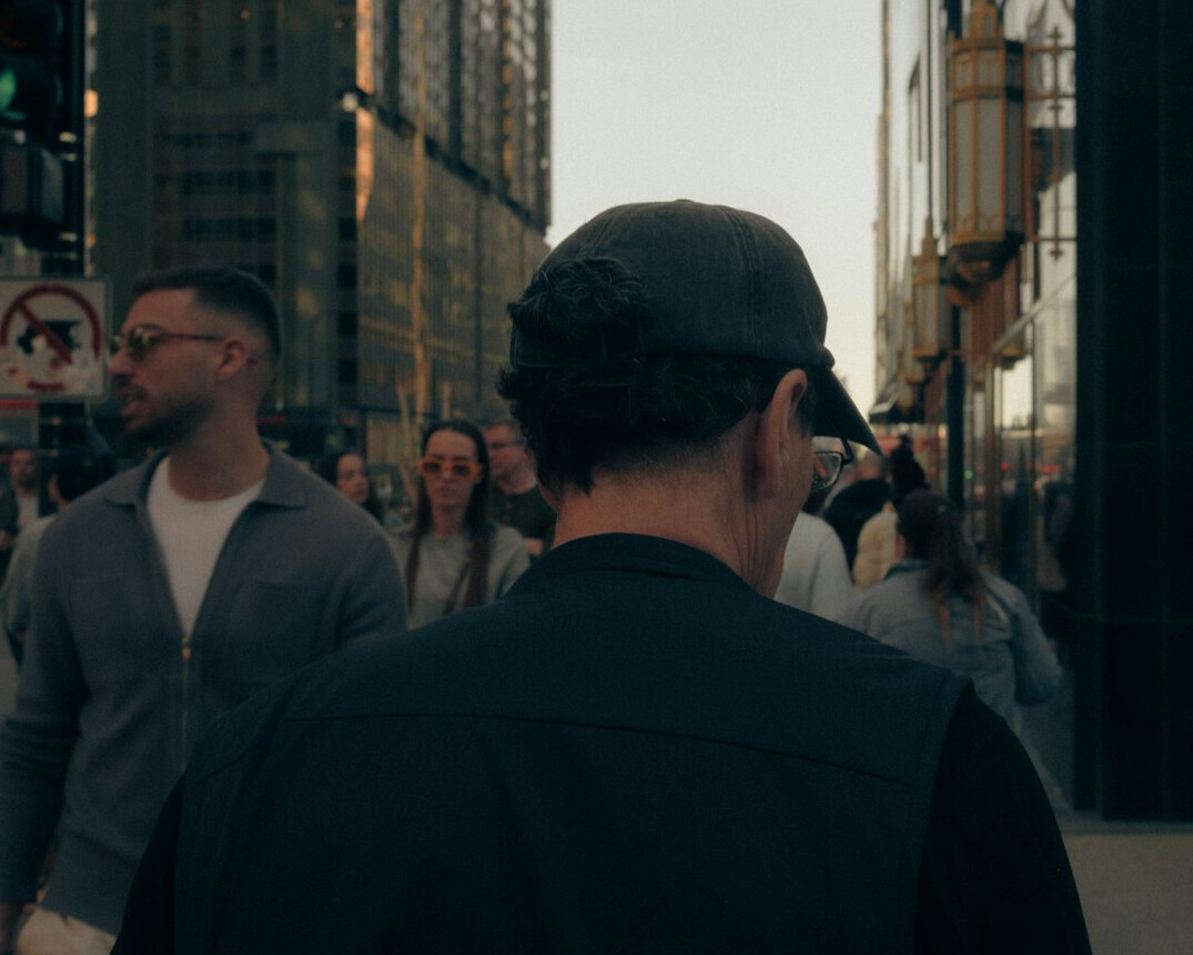 anonymous faces in city crowd