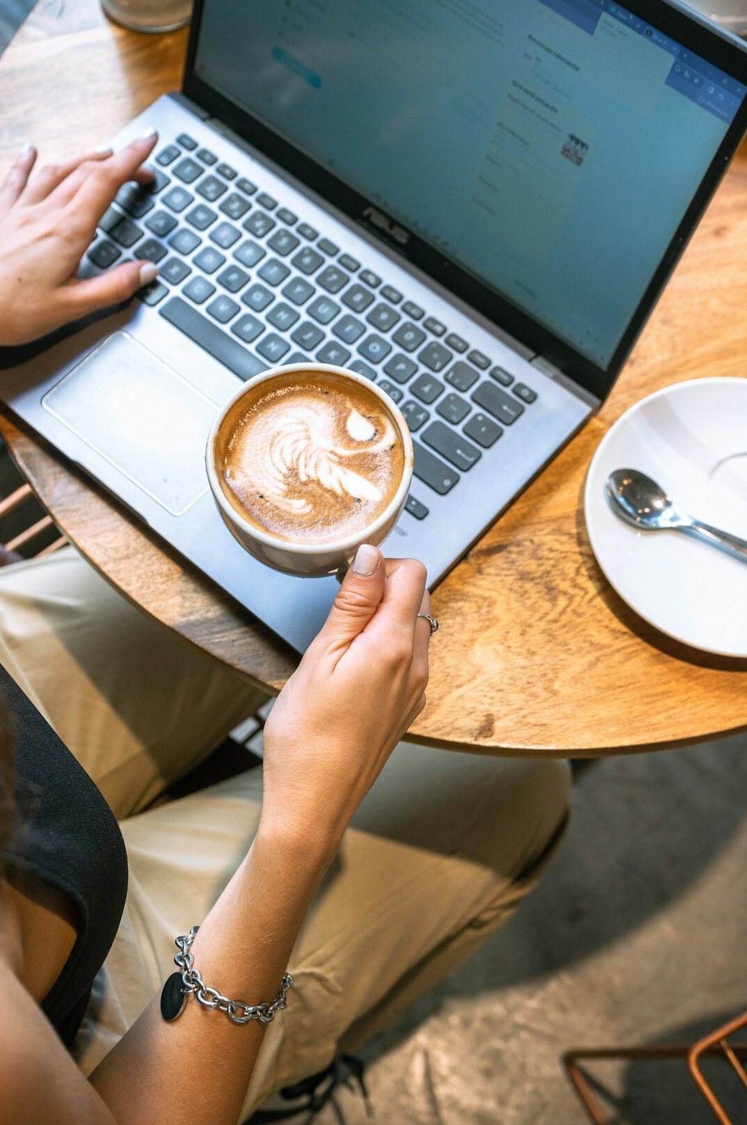 person drinking coffee in cafe