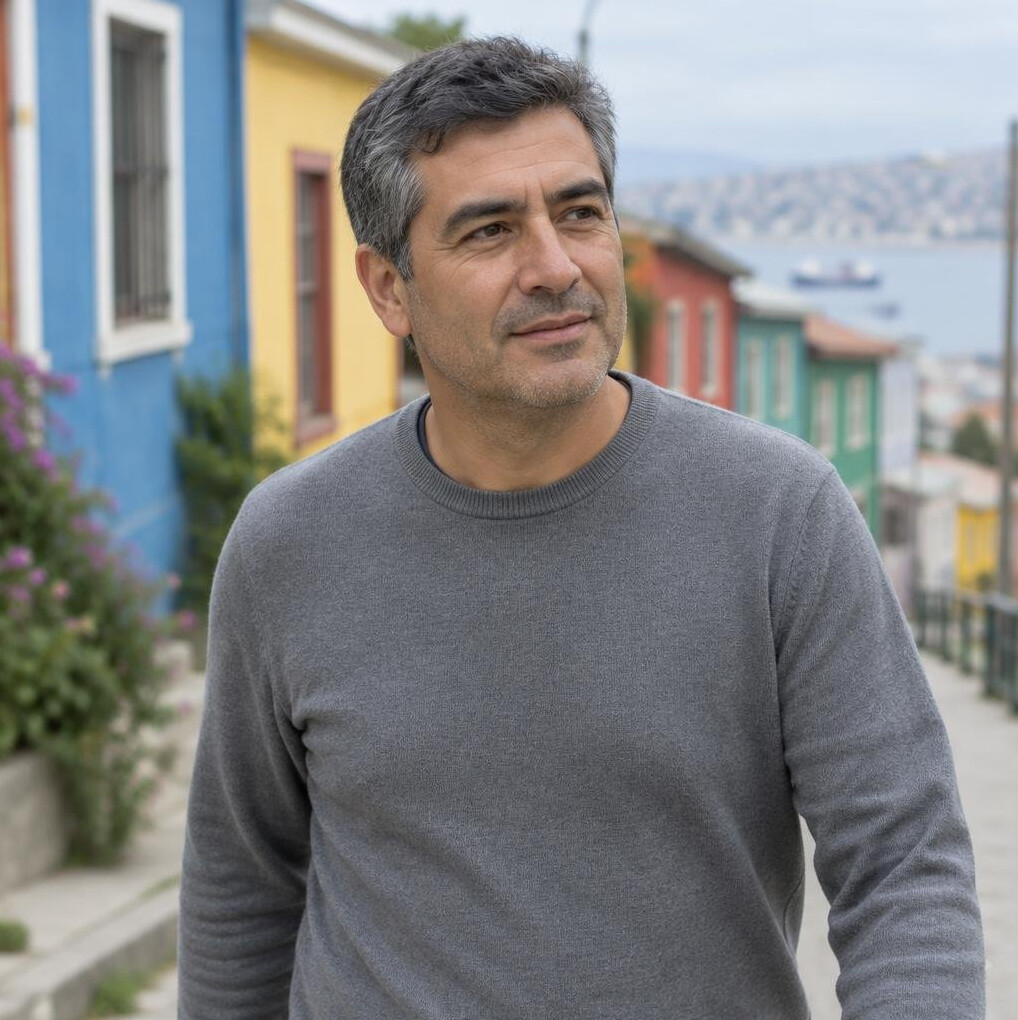Chilean man walking through a colorful street in Valparaiso