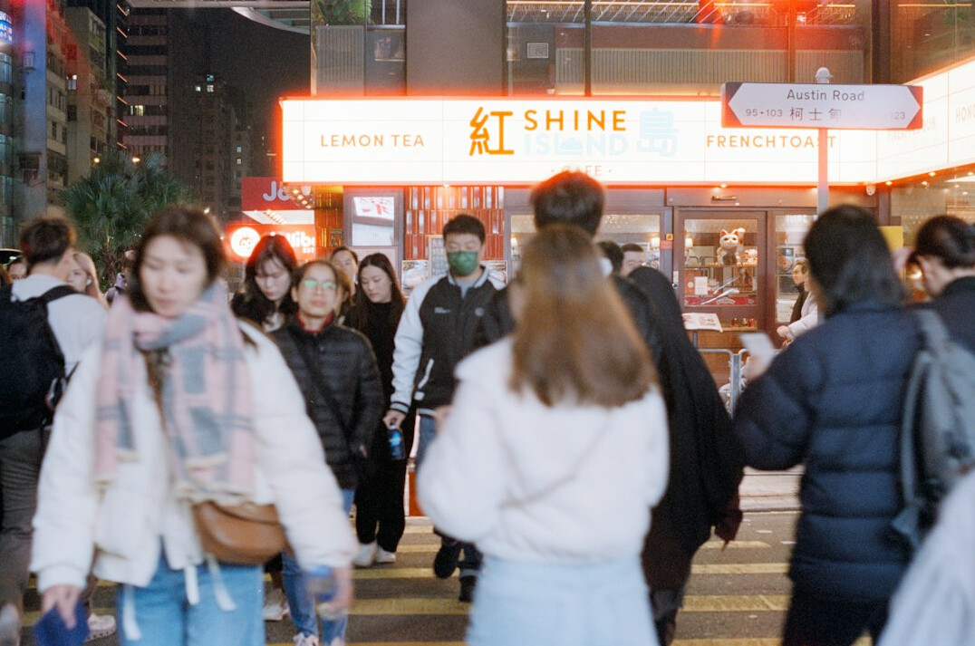 people walking in busy city street