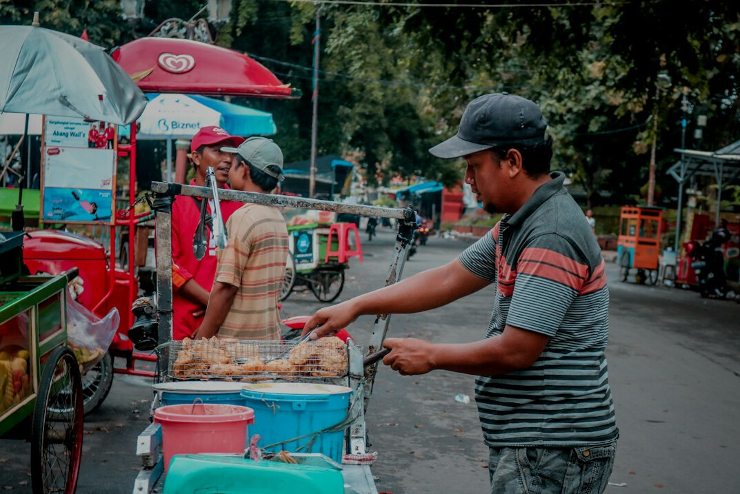 street vendor arranging stall
